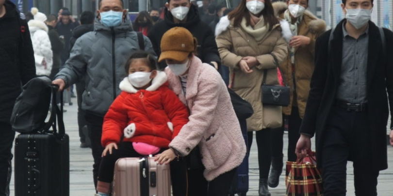 YICHANG, CHINA - JANUARY 21 2020: Travelers wearing protective masks walk outside a railway station in Yichang in central China's Hubei province Tuesday, Jan. 21, 2020. China has stepped up the measures to control the spread of the new coronavirus that has infected hundreds of people in China.- PHOTOGRAPH BY Feature China / Barcroft Media (Photo credit should read Feature China / Barcroft Media via Getty Images)