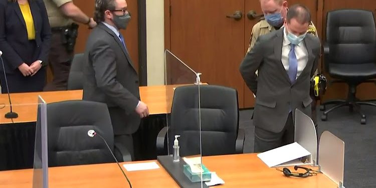 Former Minneapolis police officer Derek Chauvin is handcuffed to be led away after a jury found him guilty of all charges in his trial for second-degree murder, third-degree murder and second-degree manslaughter in the death of George Floyd in Minneapolis, Minnesota, U.S. April 20, 2021 in a still image from video. Pool via REUTERS