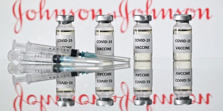(FILES) A file photo taken on November 17, 2020 shows vials with Covid-19 Vaccine stickers attached and syringes with the logo of US pharmaceutical company Johnson & Johnson. - Johnson & Johnson has applied for authorisation for their coronavirus vaccine in the EU with a decision possible by the middle of March, the European Medicines Agency said on February 16, 2021. (Photo by JUSTIN TALLIS / AFP)