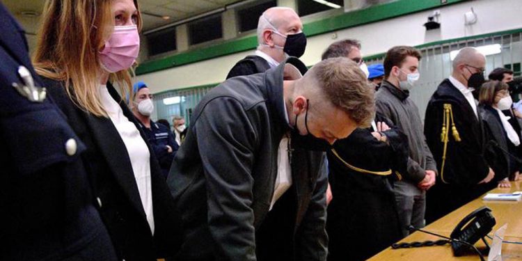 US citizen Finnegan Lee Elder (C) reacts after the court decision on May 5, 2021, during his trial, along with another US citizen on murder charges after Carabinieri officer Mario Cerciello Rega was killed in July 2019, in Rome. - An Italian court convicted two young Americans Wednesday for the 2019 murder of a police officer while they were on a summer holiday in Rome, with both handed life sentences. Finnegan Lee Elder, 21, had admitted stabbing Mario Cerciello Rega during a late-night encounter while out with his friend Gabriel Natale-Hjorth, 20, but both had claimed self-defence. (Photo by Tiziana FABI / AFP)