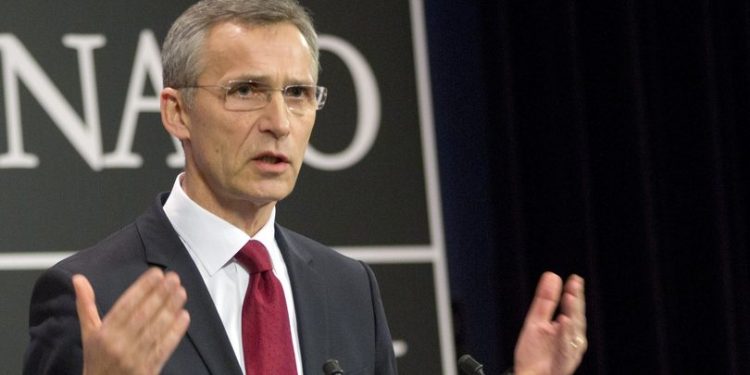 FILE - In this Feb. 5, 2014 file photo, NATO Secretary General Jens Stoltenberg speaks during a media conference at NATO headquarters in Brussels. Top officials from NATO and Russia clashed sharply in public Friday, March 20, 2015 over who is to blame for the dramatically worsened state of East-West relations. (AP Photo/Virginia Mayo, File)