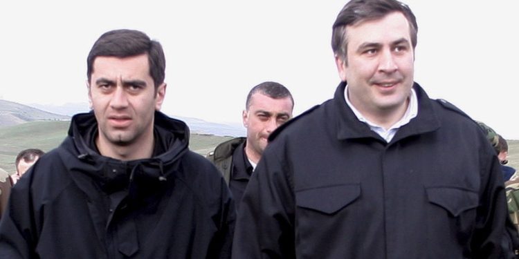 epa01133272 (FILE) An undated file photo shows former Georgian defence minister Irakli Okruashvili (C-L) and Georgian President Mikhail Saakashvili (C-R) at a military training ground in Orfolo, 80 km from Tbilisi, Georgia. Camouflaged police broke into the headquarters of Okruashvili's newly formed opposition party 'For United Georgia' in Tbilisi late September 27 and arrested Okruashvili on corruption charges. The arrest came days after Okruashvili alleged that President Mikhail Saakashvili ordered him to kill a prominent business man.  EPA/ZURAB KURTSIKIDZE