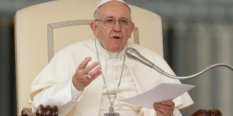 Pope Francis speaks during his general audience in St. Peter's Square at the Vatican April 18. (CNS photo/Paul Haring) See POPE-AUDIENCE-NAME April 18, 2018.