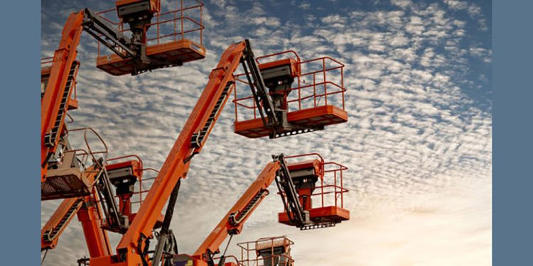 Articulated boom lift. Aerial platform lift. Telescopic boom lift against blue sky. Mobile construction crane for rent and sale. Maintenance and repair hydraulic boom lift service. Crane dealership.
